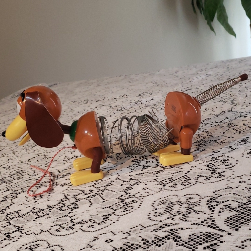Brown and Yellow Slinky pull Toy From Toy Story Movie.